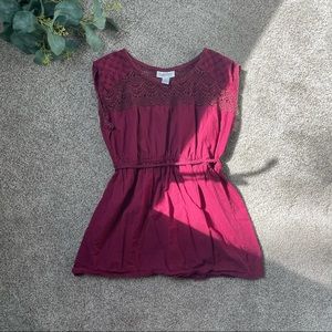 Maroon maternity blouse.